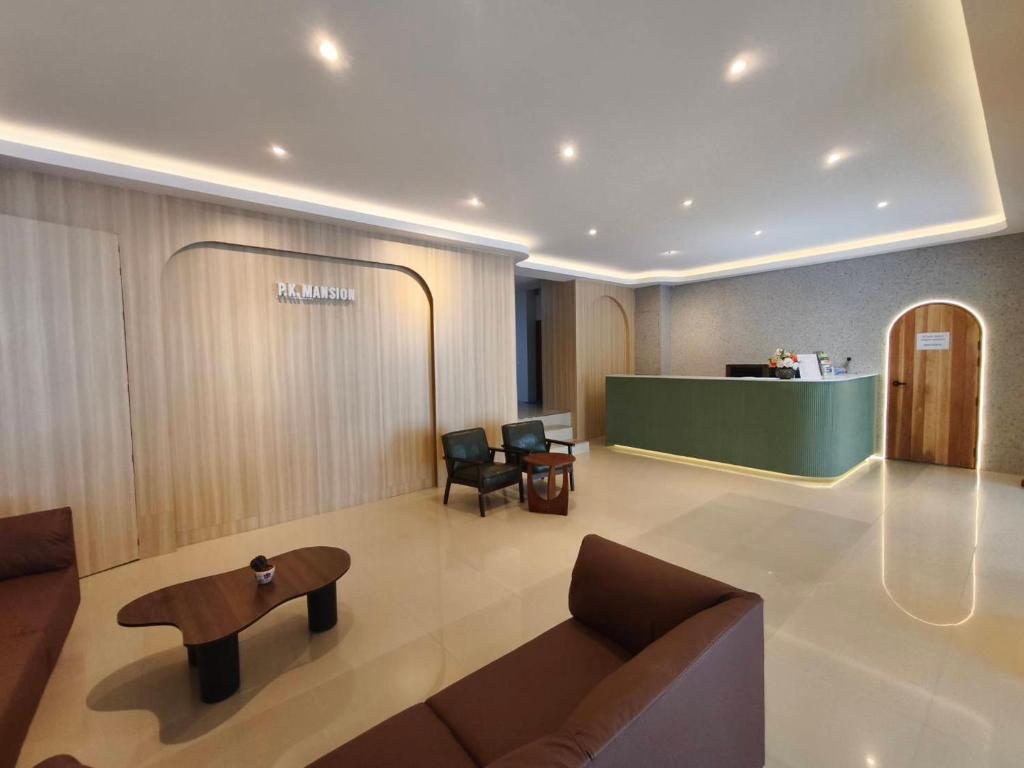 a lobby of a hospital with a couch and a table at P.K. Mansion in Ao Nang Beach