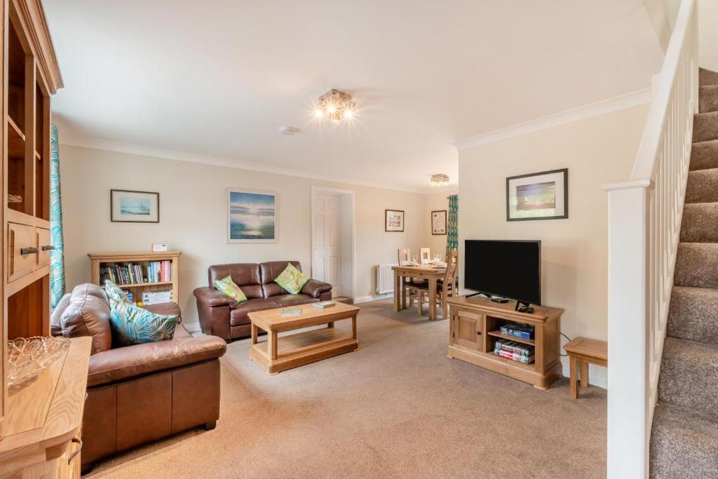 a living room with a couch and a tv at 2 Bed in Wooler oc-l29429 in Wooler