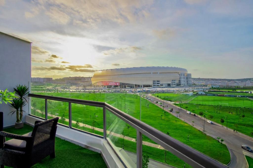 a balcony with a view of a soccer stadium at City & Stadium Luxe - Tangier in Tangier