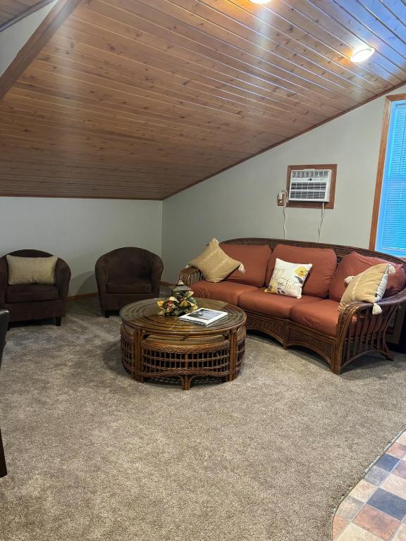 a living room with a couch and a coffee table at The Loft on the Lot in Cambridge
