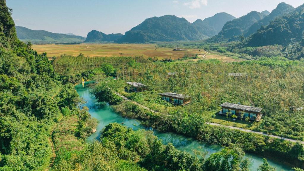 an aerial view of a river with mountains in the background at Blue Diamond Retreat in Vực Trô