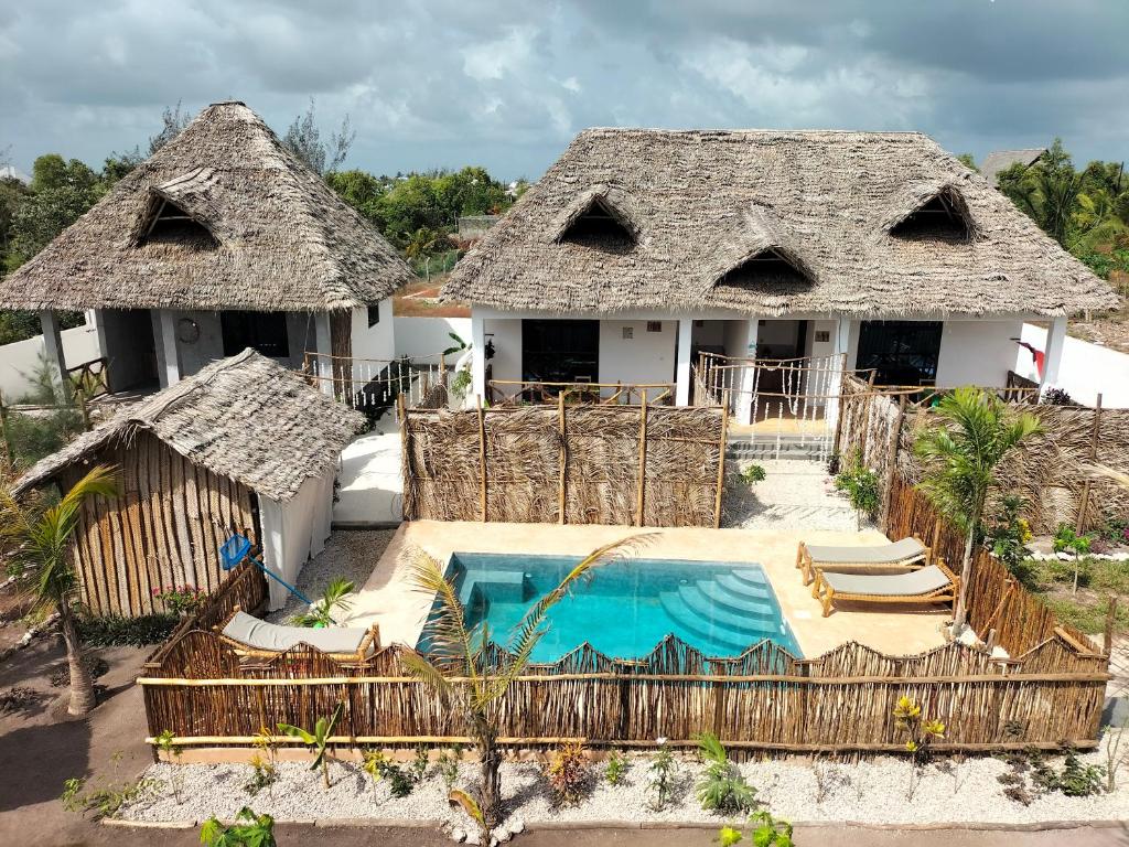 an aerial view of a house with a swimming pool at Sunset Lover in Michamvi