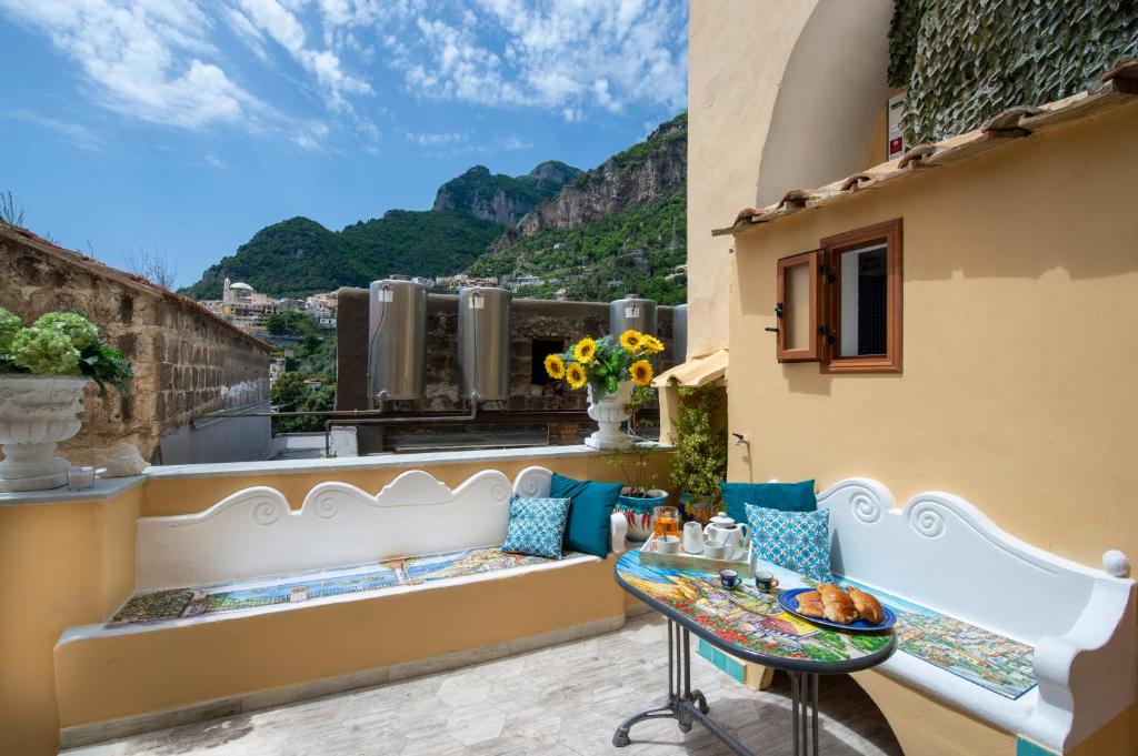 a balcony with a table and a view at Casa Sery in Positano