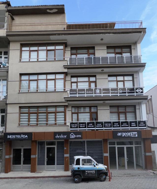 a car parked in front of a building at Hostelida Konya in Meram