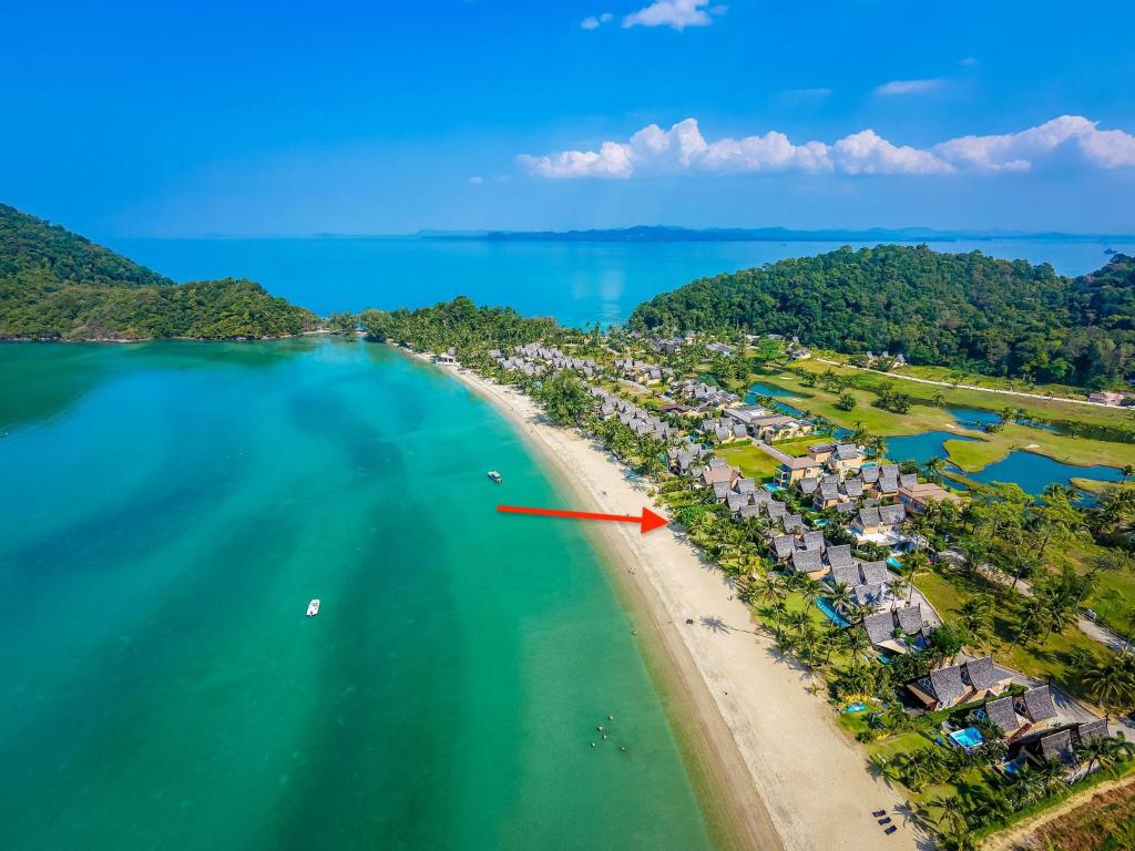 an aerial view of a beach with a resort at Tankini Beachfront Villa in Ban Khlong Son