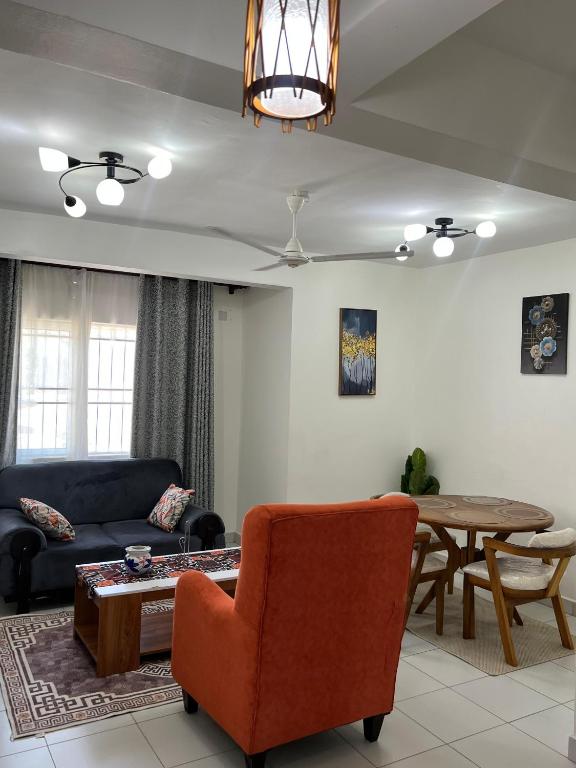 a living room with a couch and a table at Leona Homes in Mombasa