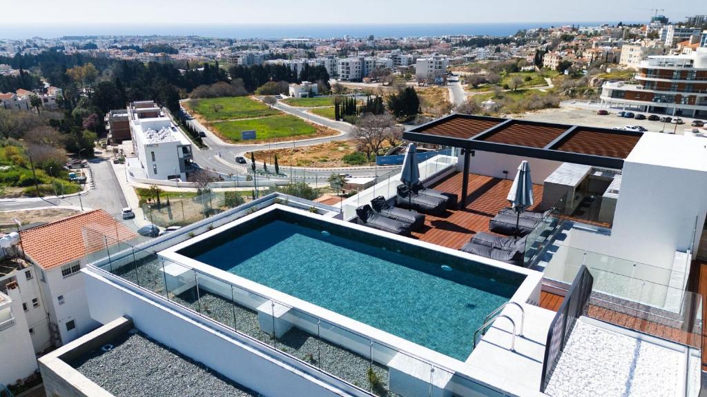 a swimming pool on the roof of a house at Prestige 402 1 BED in Paphos