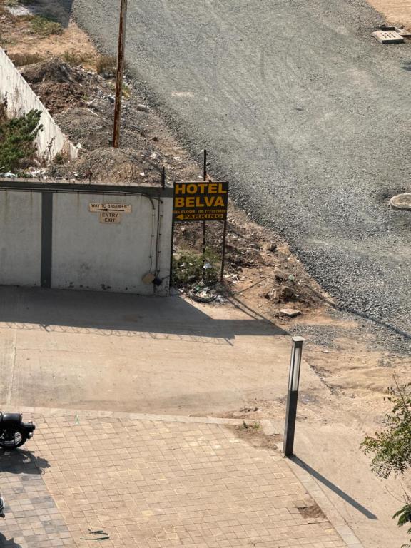 a hotel beware sign on the side of a road at hotel belva in Ahmedabad