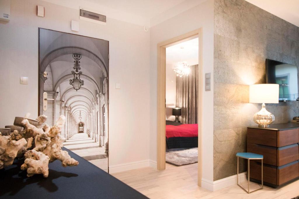 Postel nebo postele na pokoji v ubytování Kings City - Skawińska Apartment