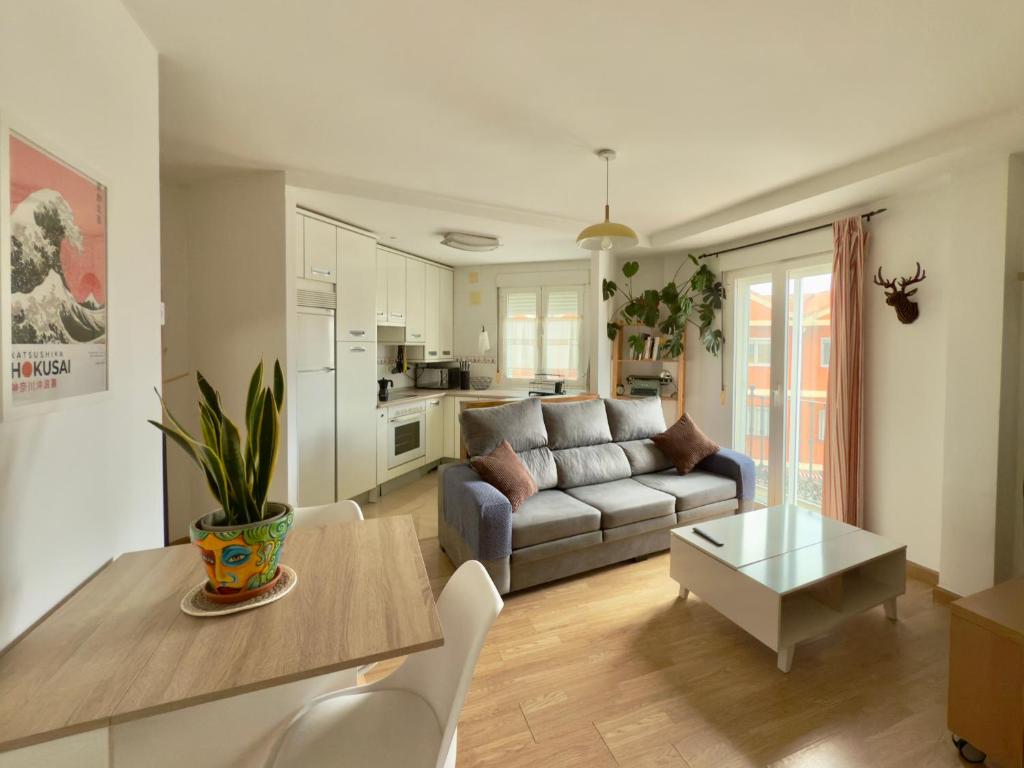 a living room with a couch and a table at La Encarnación in Ávila