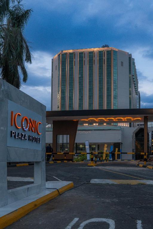 a hotel with a sign in front of a building at Iconic Plaza Hotel in Nairobi
