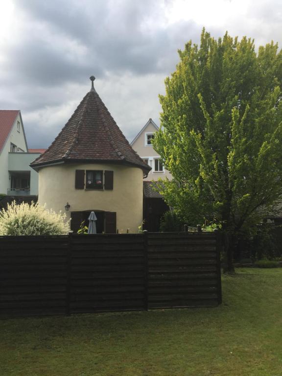 a house with a fence in front of it at Turm an der Mauer in Ellwangen