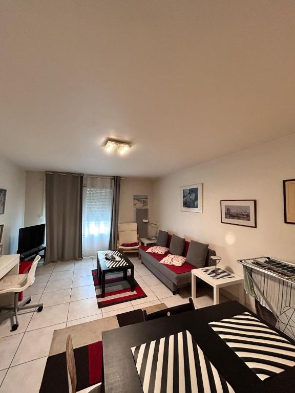 a living room with a couch and a table at 31 Bd De Launay in Nantes