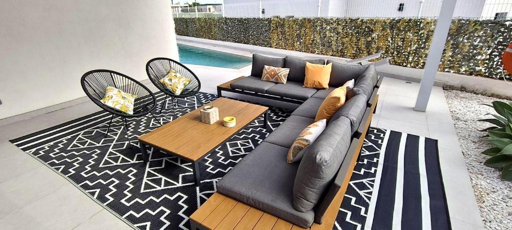a living room with a couch and a table at Villa Mojacar in Mojácar