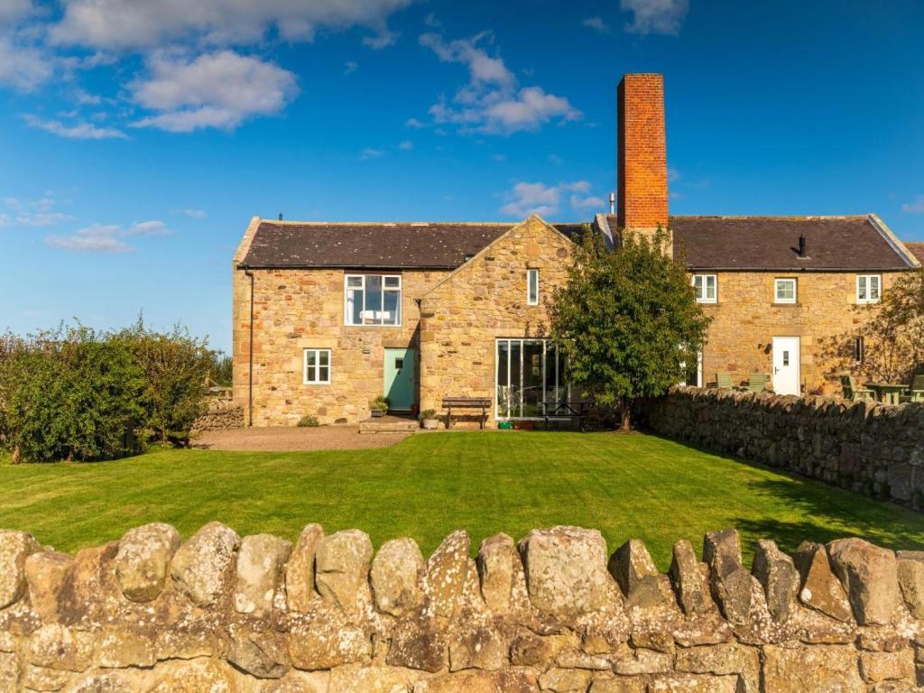 an old stone wall in front of a house at 3 Bed in Belford oc-89518 in Belford