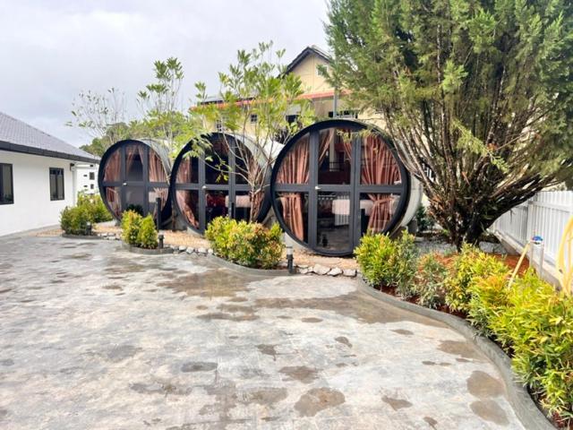 a house with two domes in the middle of a yard at AURELIA Stay in Brinchang
