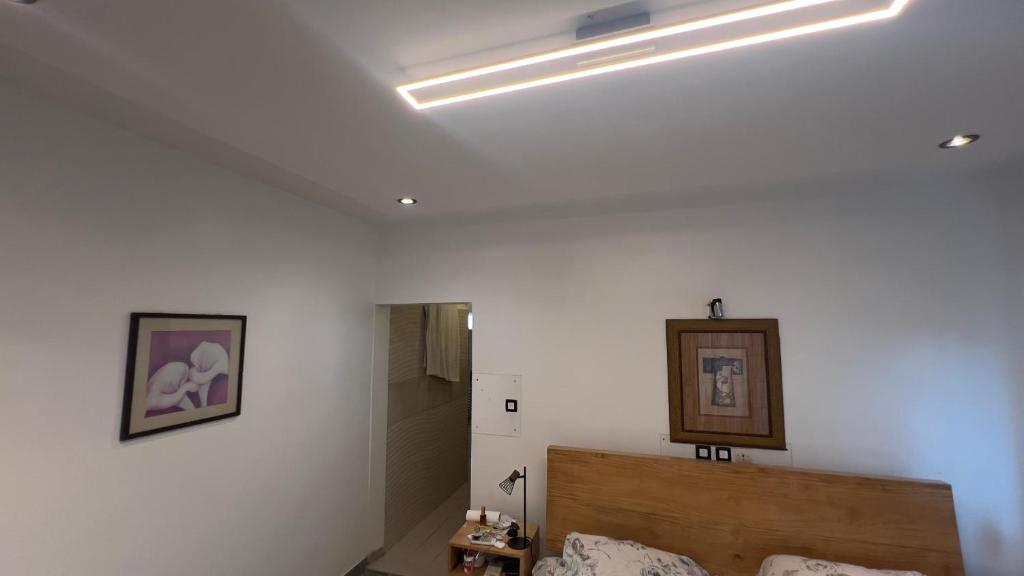 מיטה או מיטות בחדר ב-Toffa