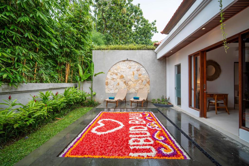 a welcome mat in the courtyard of a house at Yoga Sri Ubud Hotel & Spa in Ubud