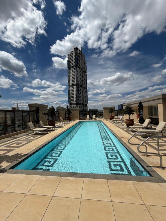 a swimming pool on the roof of a building at Michelangelo Towers in Johannesburg