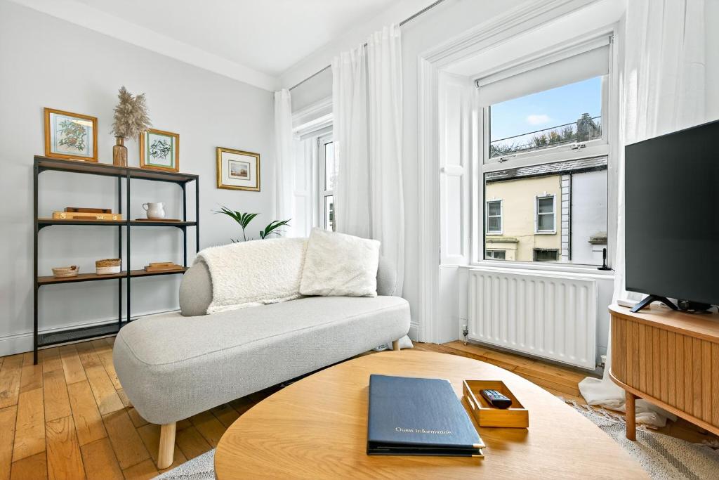 a living room with a couch and a table at Wolfe Tone Apartment 2 in Sligo