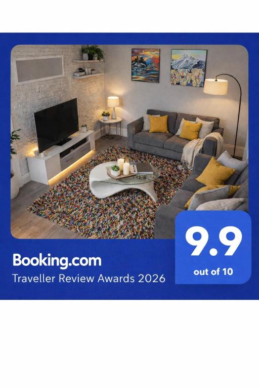 a living room with a couch and a tv at Teviot View Holiday Let’s Hawick in Hawick