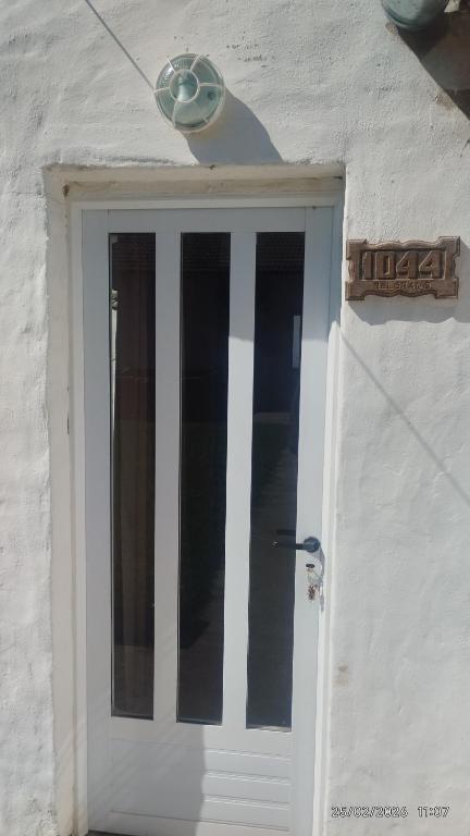 a white door with a light on top of it at Mab departamento in Colorado River