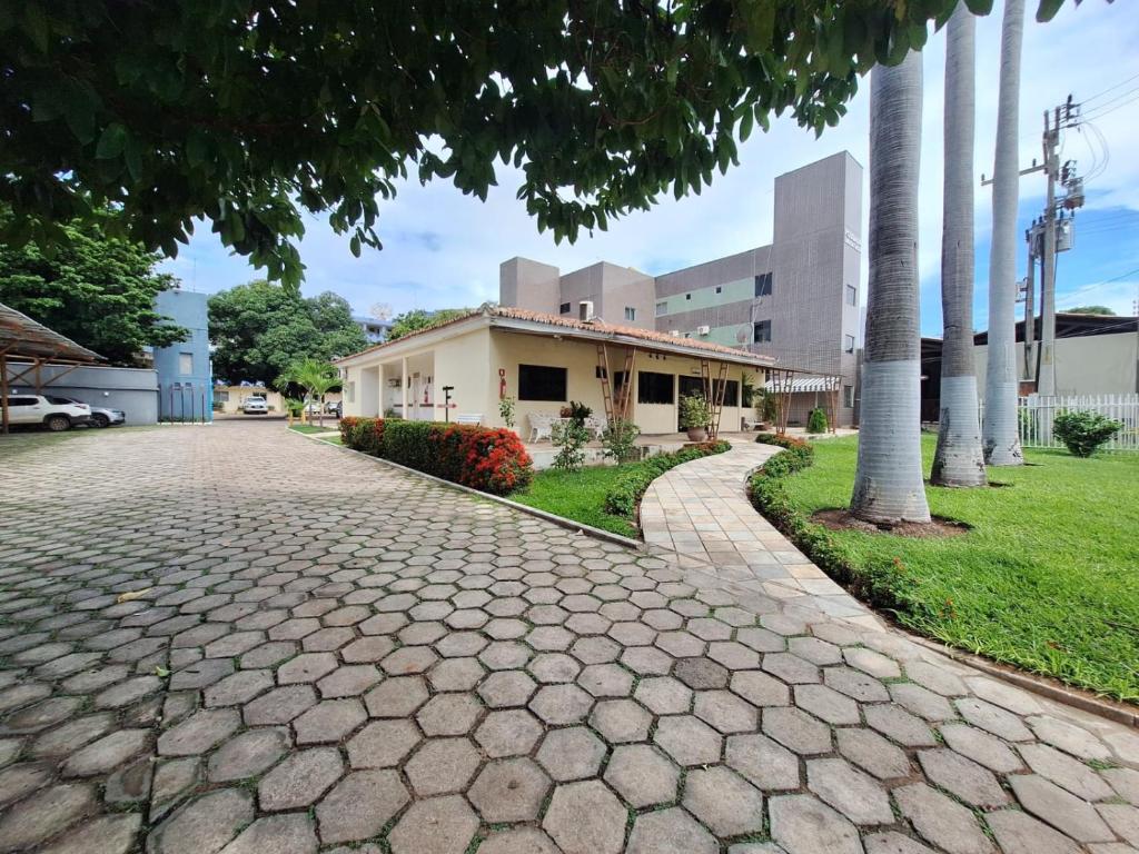a cobblestone street in front of a building at Pousada Lagoa Seca in Juazeiro do Norte