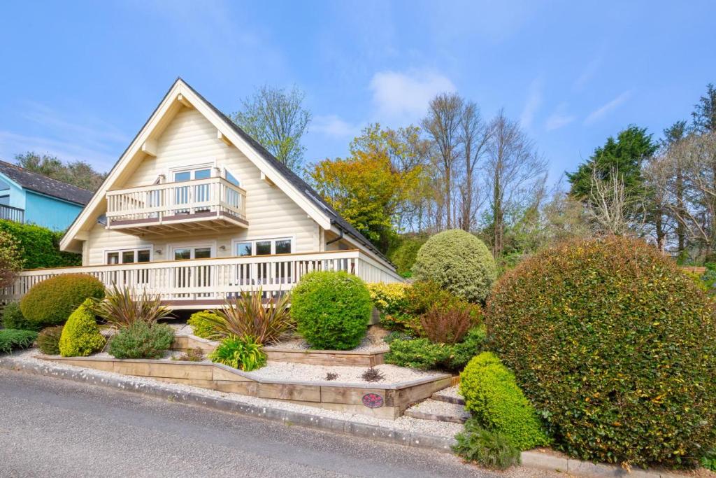 a house with a porch and bushes in front of it at 3 Bed in Little Petherick oc-maplod in Little Petherick
