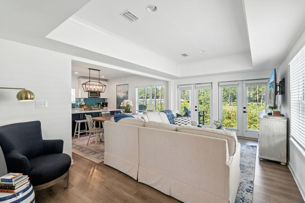 a living room with a couch and a dining room at Famiy and Pet friendly, close to Wharf, pool in Orange Beach