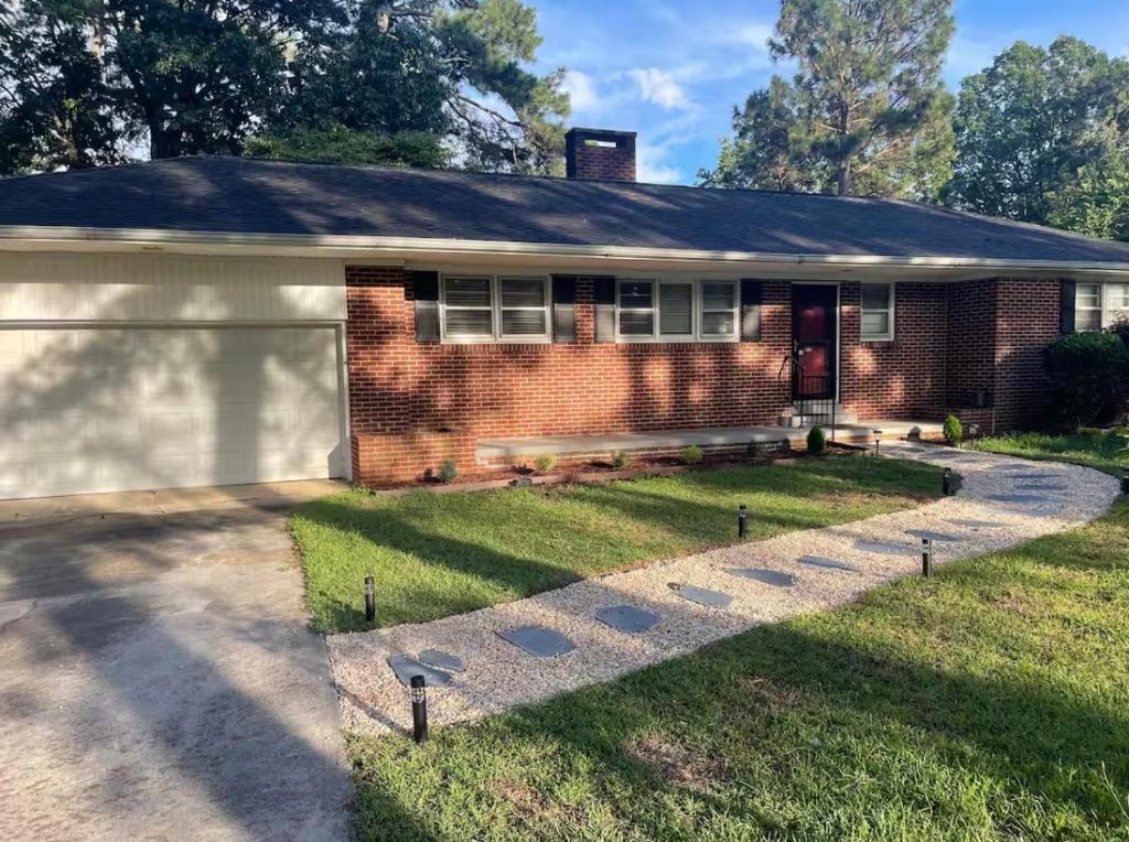 a brick house with a garage at Extra listing do not book in Sanford