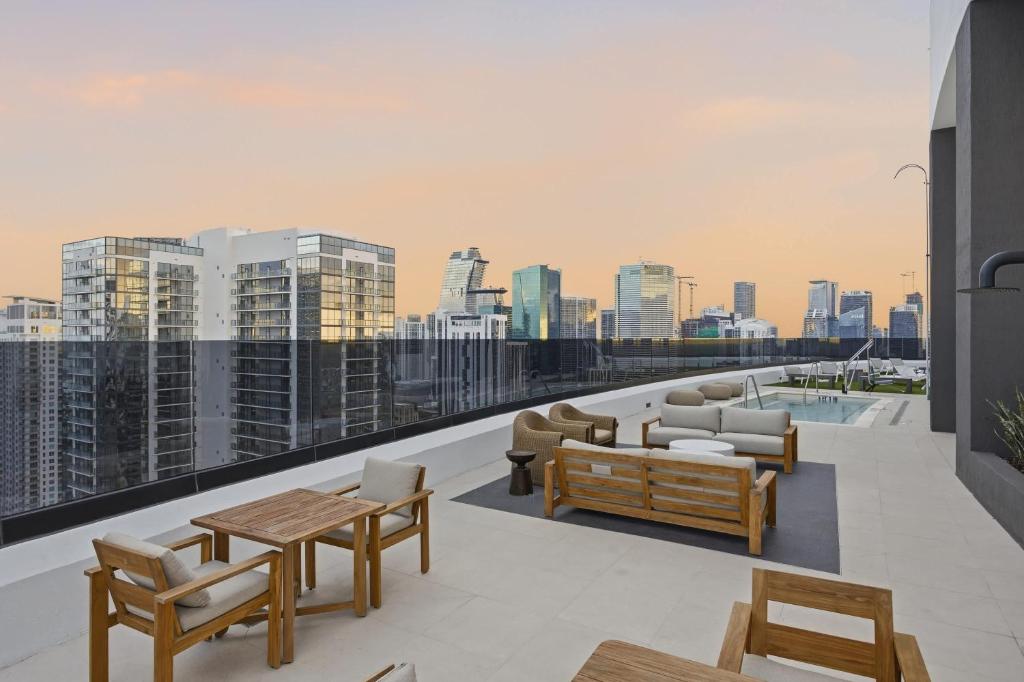 a balcony with furniture and a view of the city at Upscale Downtown Condo Pool Gym & Skyline Views in Miami