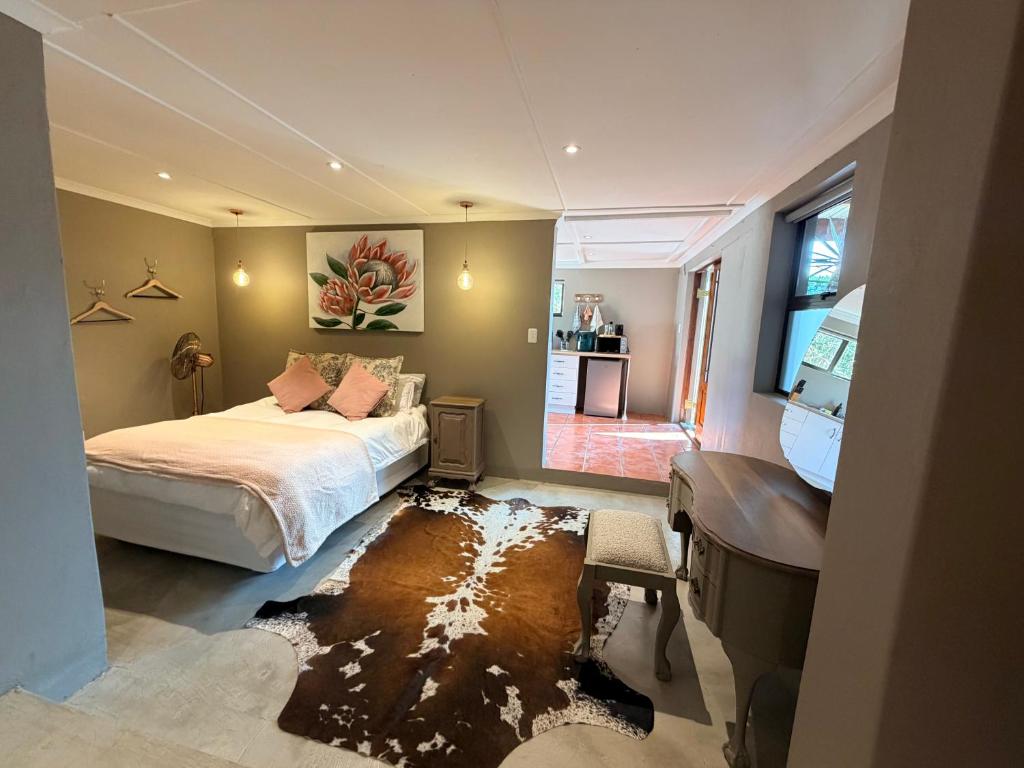 a bedroom with a bed and a dirty floor at Uys Cottage on 79 in Heidelberg