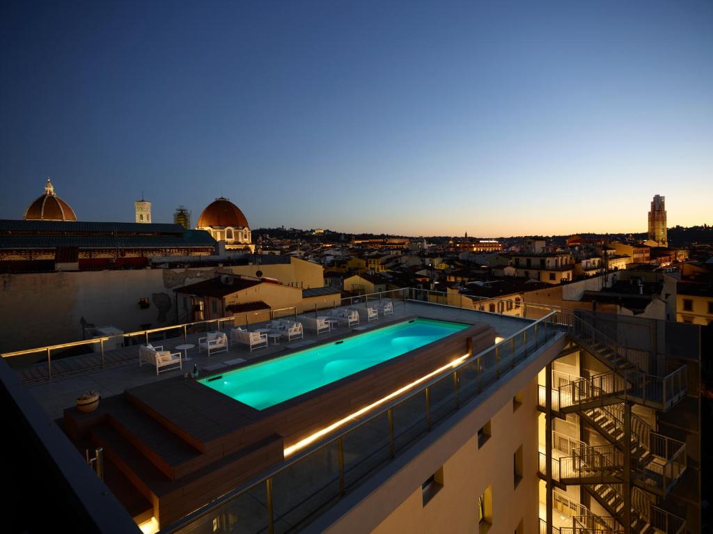 a swimming pool on the roof of a building at Hotel Glance In Florence in Florence