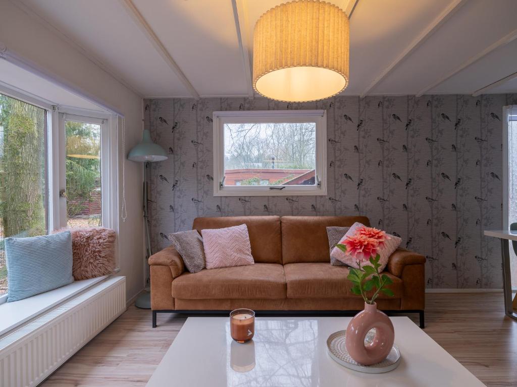 a living room with a couch and a table at Ermway Cottage in Erm