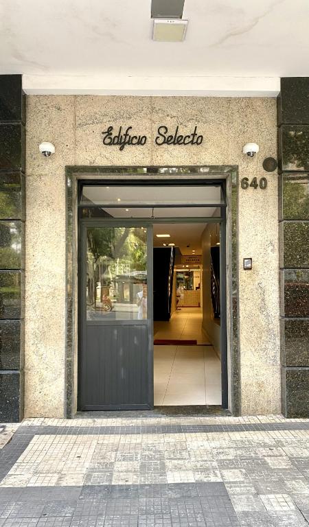 a building with a door to a store at Dom Carlos in Belém