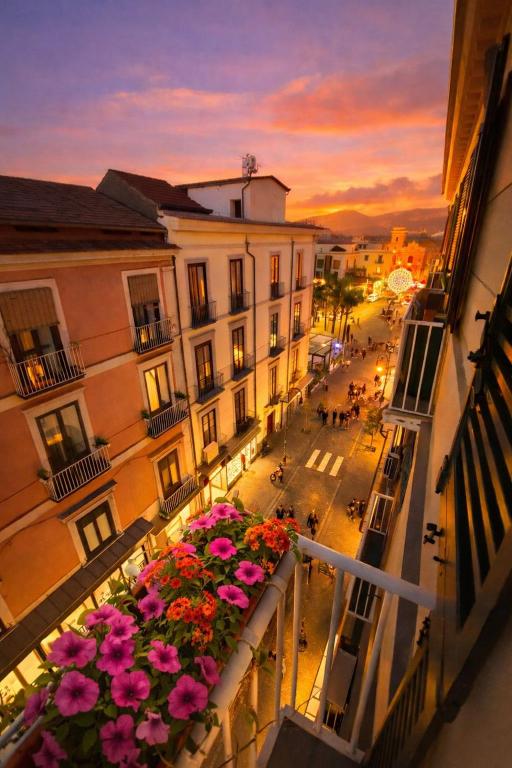 a view of a city with flowers on a balcony at Sorrento Downtown in Sorrento