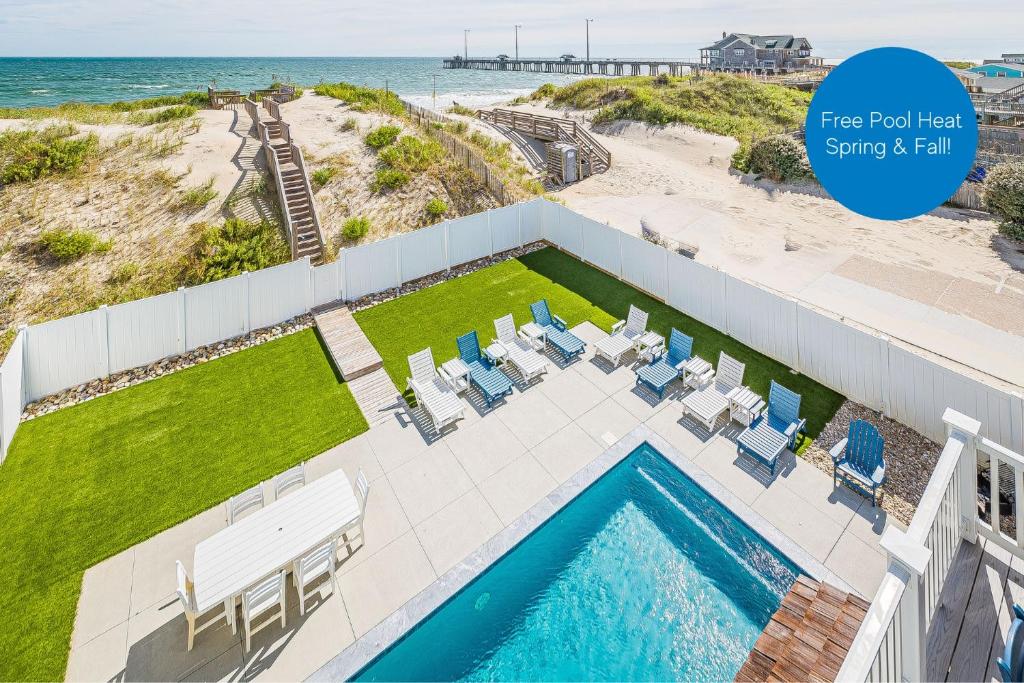 an image of a swimming pool and the beach at Pier View Oasis - Nags Head MP 16, Oceanfront, Elevator, Theater, Pool, Hot Tub, Pets OK in Nags Head