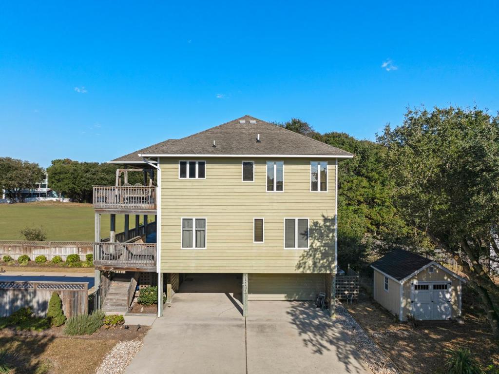 an aerial view of a house with a porch at The Sand Wedge in Kitty Hawk
