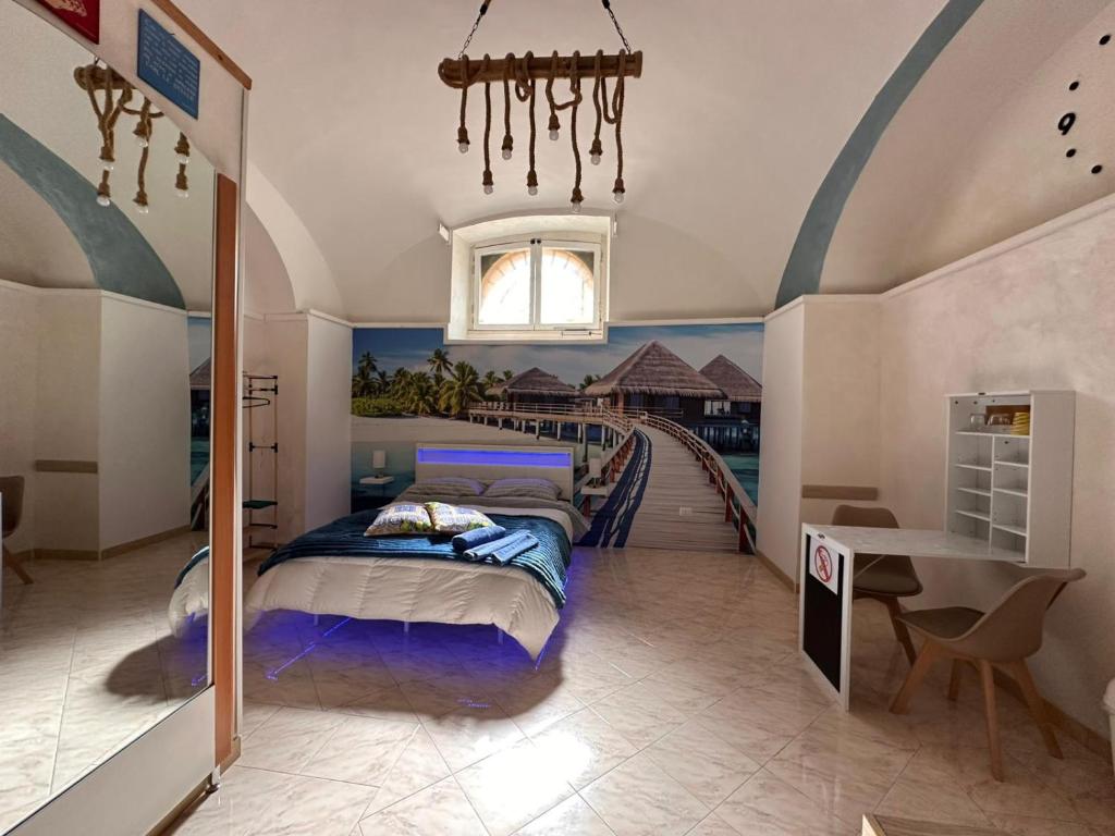 a bedroom with a bed in a room with a staircase at Dea in Maddaloni