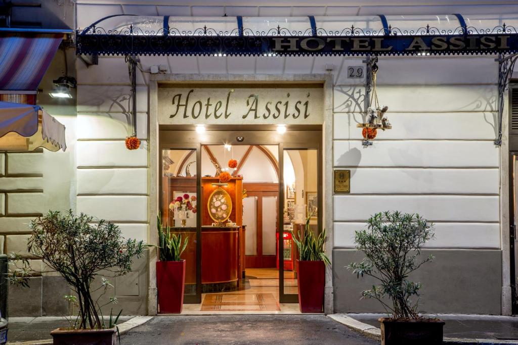 a hotel australias front door with a sign on it at Hotel Assisi in Rome