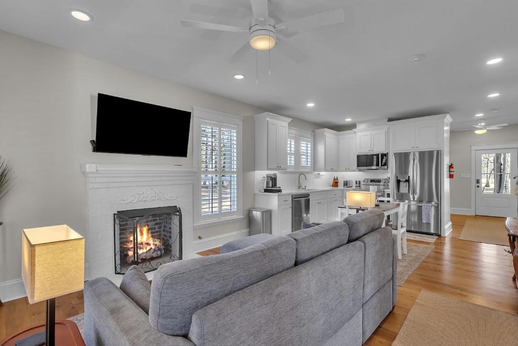 a living room with a couch and a fireplace at The Park House in Batesville