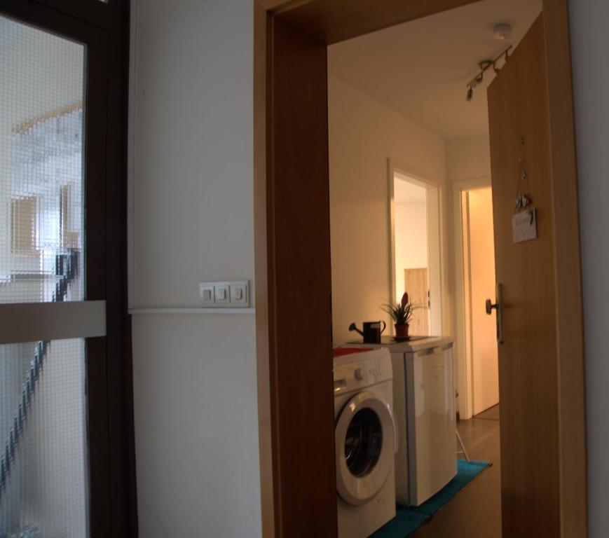 a laundry room with a washer and a washing machine at Ruhiges Nest in Bad Endorf