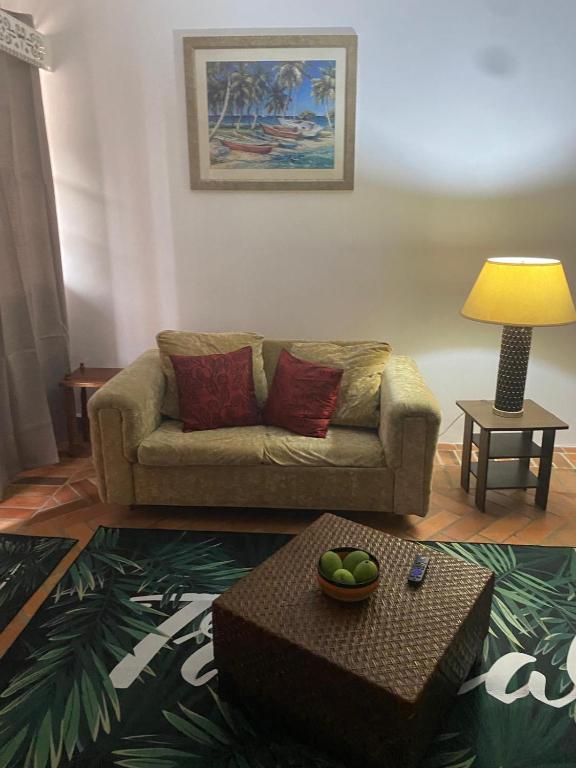 a living room with a couch and a table at Kaye Jacquot in Monchy