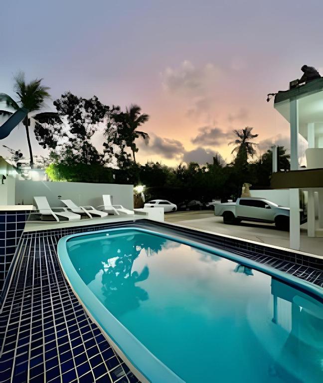 a swimming pool in front of a house at PARAISO A BEIRA Mar de Antunes, conforto,Piscina,Mar e Natureza in Maragogi