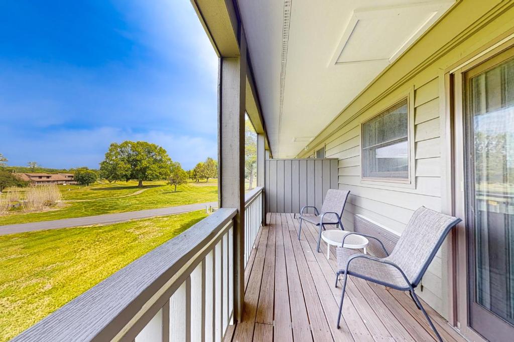 a porch with two chairs and a window at Inviting & Cozy Studio Sleep 4 Shared Gym & Games in Baneberry