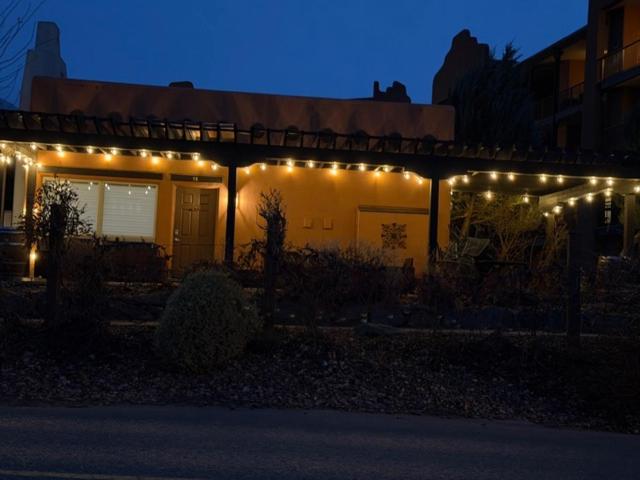 a lit up house with lights on it at night at Lakeshore Villa Estates in Osoyoos