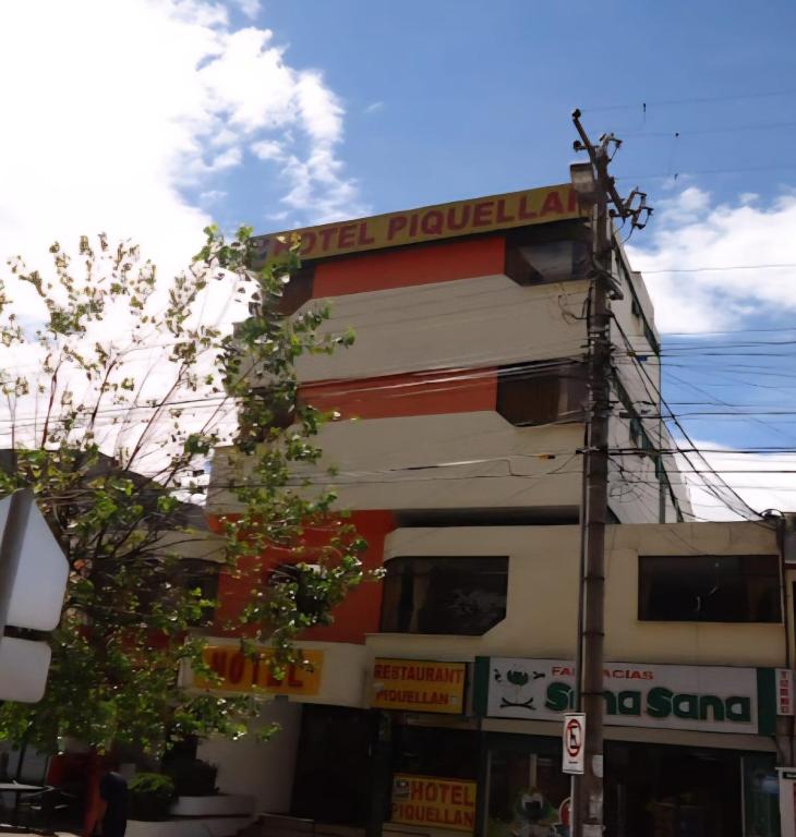 a building with a sign on the side of it at Hotel Piquellan in Quito