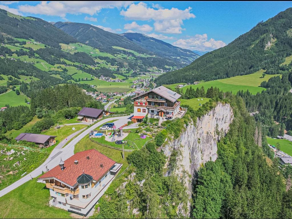 an aerial view of a house on the side of a mountain at Falkenstein in Krimml