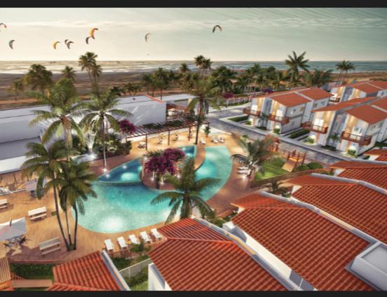 an aerial view of a resort with a swimming pool at Maramarbh43 in Luis Correia