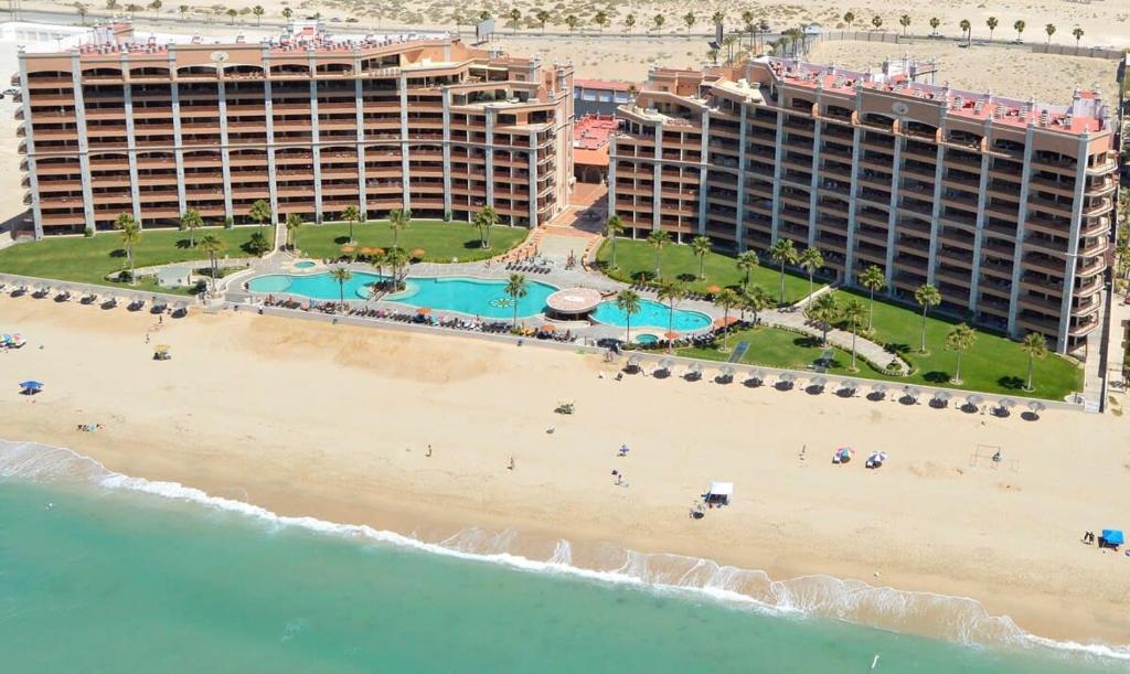 an aerial view of a beach with two hotels at Oceanfront Sunsets at Sonoran Spa E305 in Puerto Peñasco
